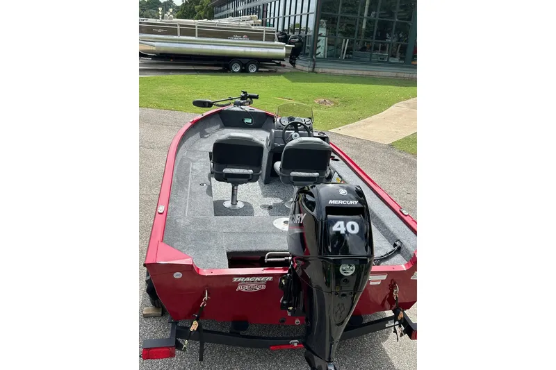 Slide: The Image of 2026 Tracker Super Guide V-16 SC boat with Mercury 40 engine, parked outdoors. - 50