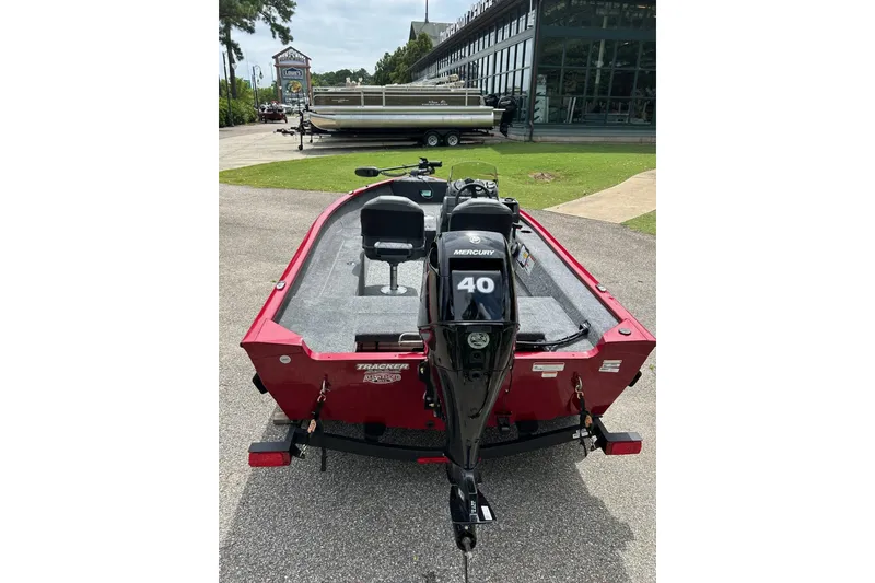 Slide: The Image of 2026 Tracker Super Guide V-16 SC boat with Mercury 40 engine, parked outdoors. - 51