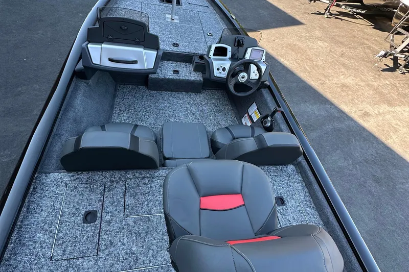 Slide: The Image of 2026 Tracker Pro Team 175 boat interior with modern seating and control panel. - 3