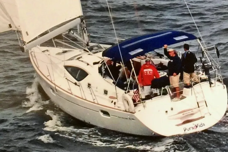 The Image of 2007 Jeanneau Sun Odyssey 42 DS sailing on open water with crew onboard. - 0