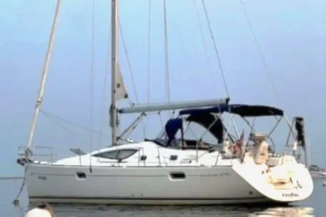 Slide: The Image of 2007 Jeanneau Sun Odyssey 42 DS sailboat on calm water, side view. - 10