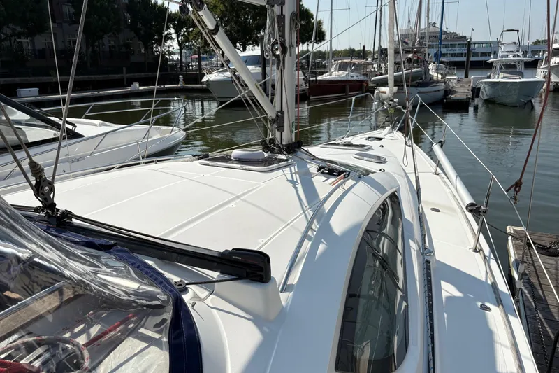 Slide: The Image of 2007 Jeanneau Sun Odyssey 42 DS sailboat docked in a marina. - 11
