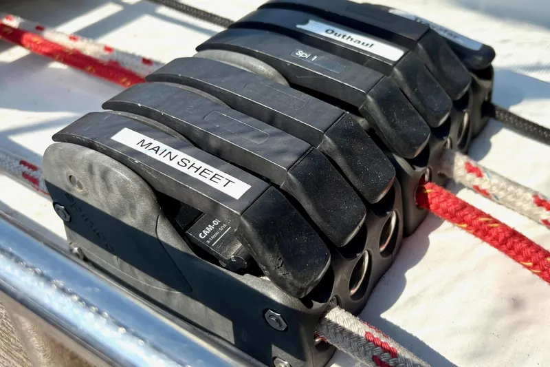 Slide: The Image of Close-up of rope clutches labeled "Main Sheet" on a 2007 Jeanneau Sun Odyssey 42 DS sailboat. - 14