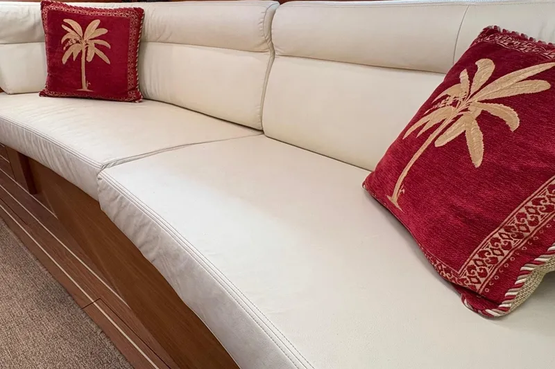 Slide: The Image of Luxurious interior seating with palm-themed cushions on 2007 Jeanneau Sun Odyssey 42 DS yacht. - 22