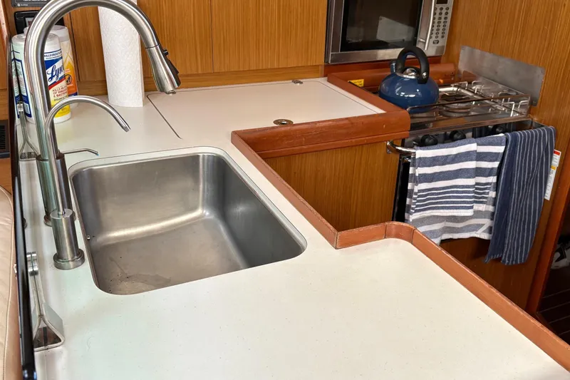 Slide: The Image of Galley kitchen in 2007 Jeanneau Sun Odyssey 42 DS sailboat with sink and stove. - 29
