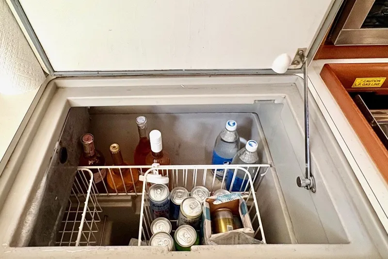 Slide: The Image of Built-in cooler with drinks on Jeanneau Sun Odyssey 42 DS, 2007 model. - 30