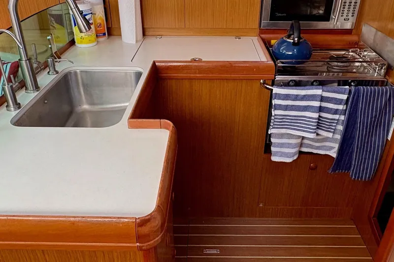Slide: The Image of Galley kitchen in 2007 Jeanneau Sun Odyssey 42 DS sailboat with sink and stove. - 32