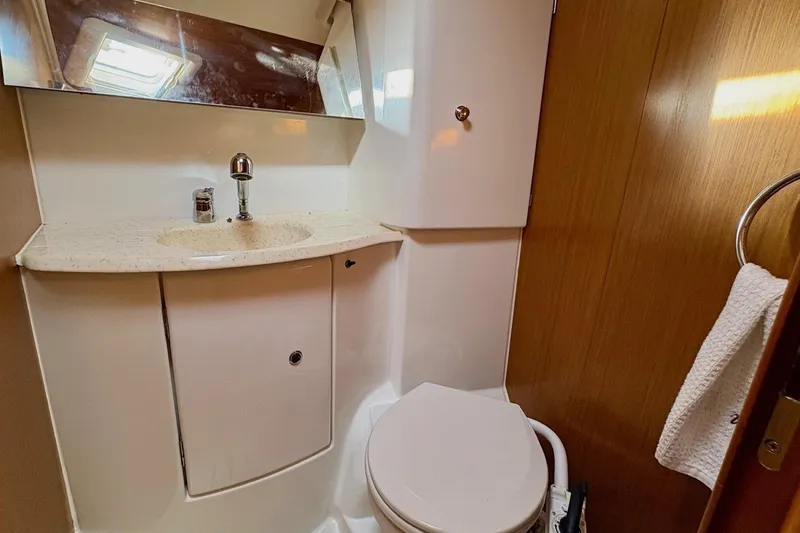 Slide: The Image of 2007 Jeanneau Sun Odyssey 42 DS yacht bathroom with sink, mirror, and toilet. - 34
