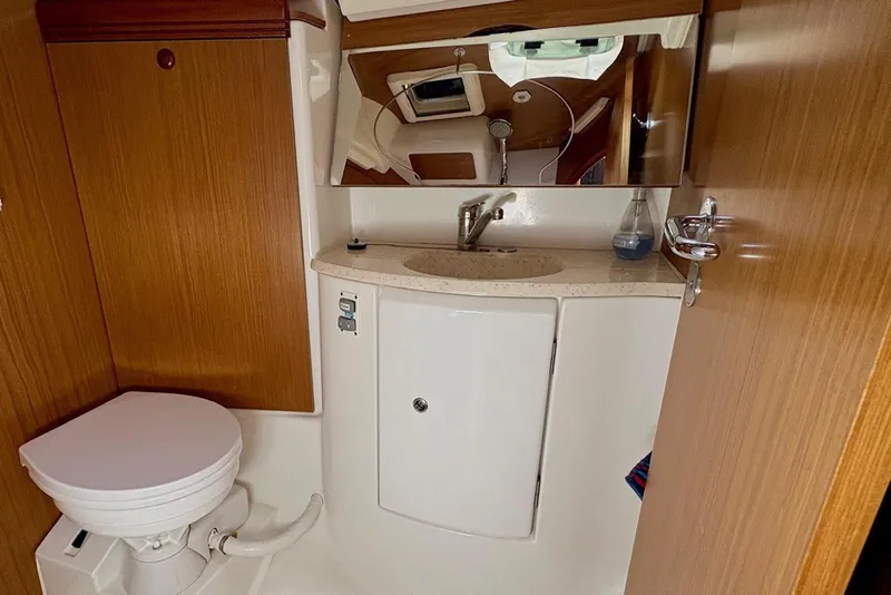Slide: The Image of 2007 Jeanneau Sun Odyssey 42 DS yacht bathroom with wooden cabinetry and modern fixtures. - 37