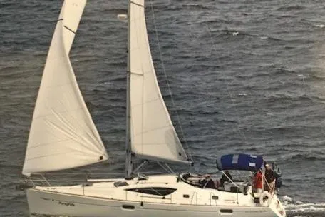 Slide: The Image of 2007 Jeanneau Sun Odyssey 42 DS sailing on open water with full sails. - 7