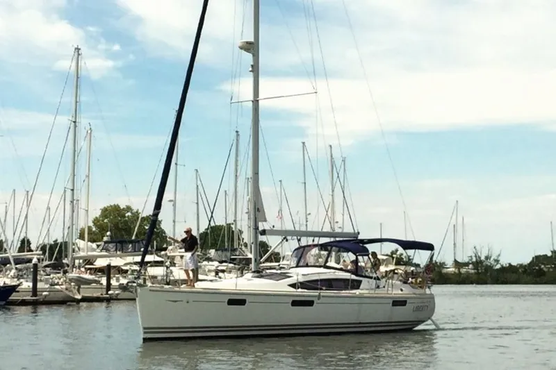 Slide: The Image of 2007 Jeanneau Sun Odyssey 42 DS sailboat docked in a marina with clear skies. - 9
