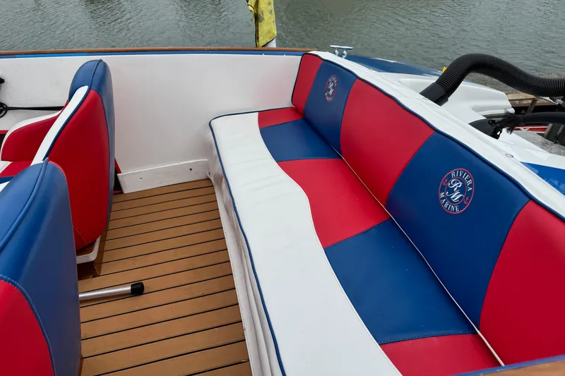 Slide: The Image of Red and blue custom boat seats with Riviera Marine logo, 2021 model. - 14