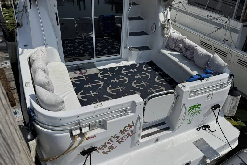 Slide: The Image of 1998 Mainship 31 Sedan Bridge boat with cozy seating and nautical decor. - 6