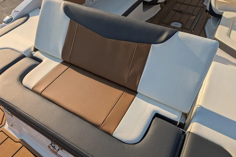 Slide: The Image of 2023 Chaparral 23 SSi boat seat with brown and white upholstery. - 12