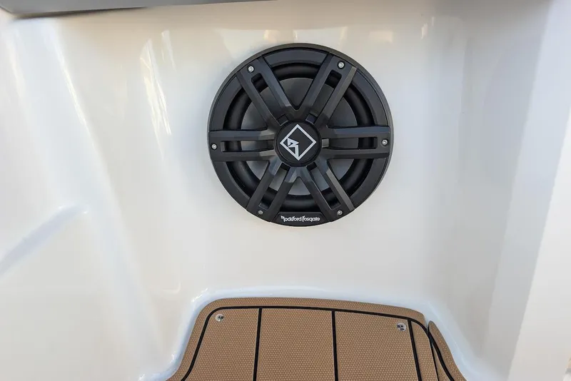 Slide: The Image of 2023 Chaparral 23 SSi boat with Rockford Fosgate speaker and teak-style flooring. - 21