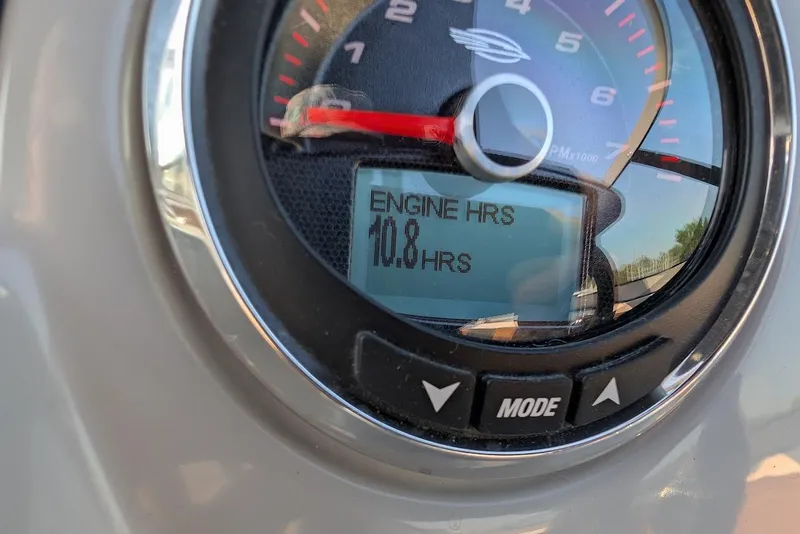 Slide: The Image of Close-up of 2023 Chaparral 23 SSi engine hour meter displaying 10.8 hours. - 24