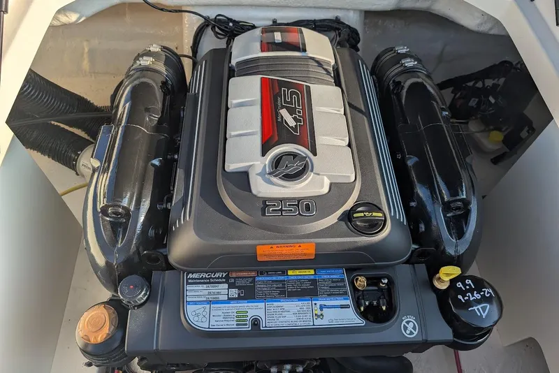 Slide: The Image of Engine of 2023 Chaparral 23 SSi boat, featuring a Mercury 4.5L 250 horsepower motor. - 25