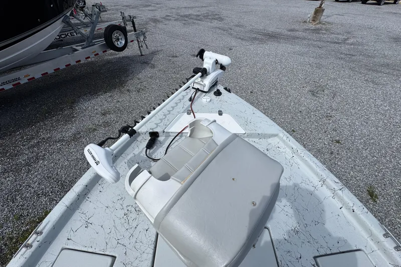 Slide: The Image of 2018 Blazer Bay 2170 boat with Minn Kota trolling motor on gravel lot. - 16