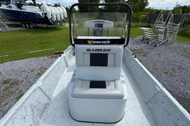 Slide: The Image of 2018 Blazer Bay 2170 boat interior with Minn Kota equipment, parked on gravel. - 20