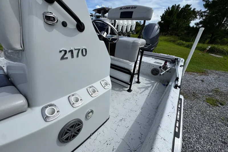 Slide: The Image of 2018 Blazer Bay 2170 boat interior with seating and control panel. - 21
