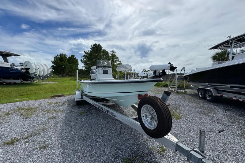 Slide: The Image of 2018 Blazer Bay 2170 boat on trailer under cloudy sky. - 4