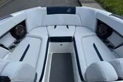 Slide: The Image of 2021 MasterCraft X24 engine compartment with Ilmor marine engine, featuring blue and black components. - 14