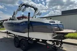 Slide: The Image of 2021 MasterCraft X24 boat interior with white and navy seating. - 7