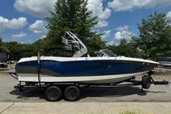 Slide: The Image of 2021 MasterCraft X24 boat interior with modern dashboard and steering wheel. - 8