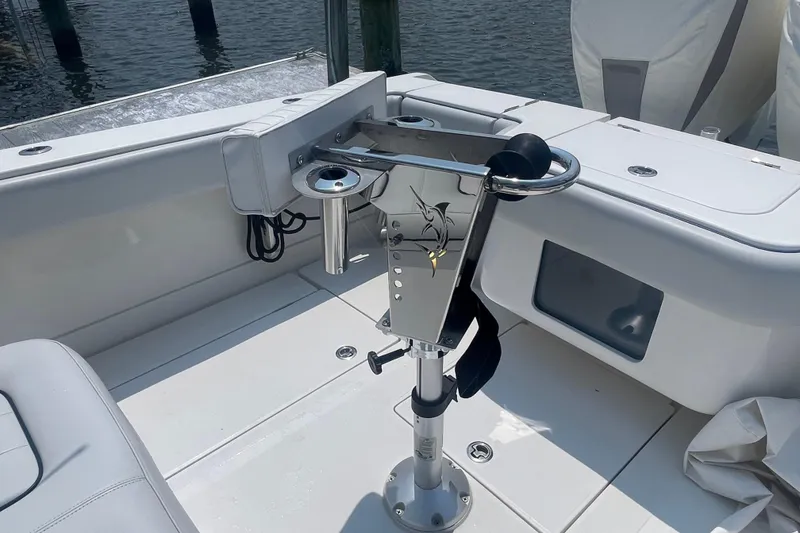 Slide: The Image of Fishing rod holder on a 2020 Jupiter 38 boat deck, near water. - 15