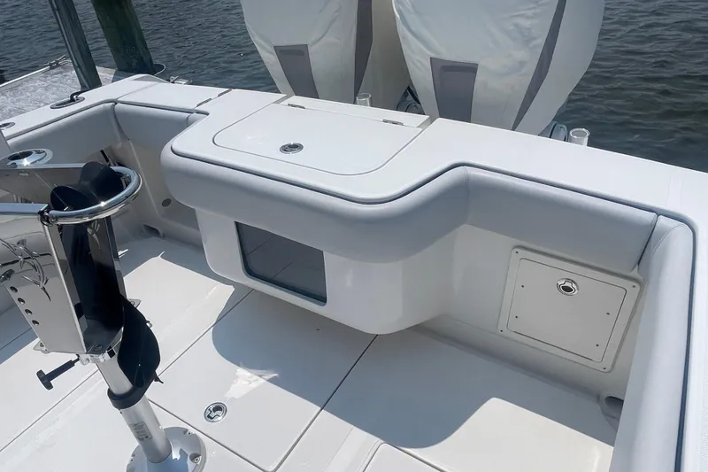 Slide: The Image of 2020 Jupiter 38 boat interior with seating and storage, docked by the water. - 16