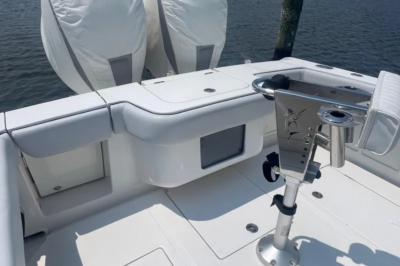 Slide: The Image of 2020 Jupiter 38 boat deck with fishing rod holder and cushioned seating. - 17
