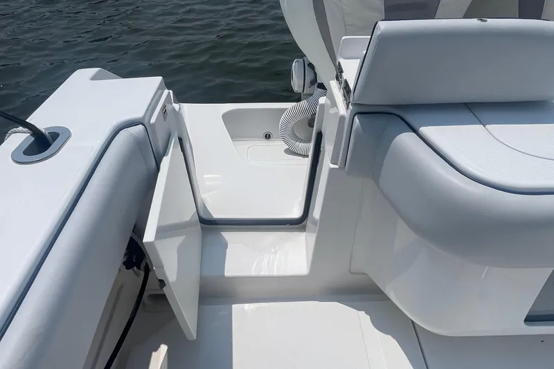 Slide: The Image of 2020 Jupiter 38 boat interior with open storage compartment and seating. - 19