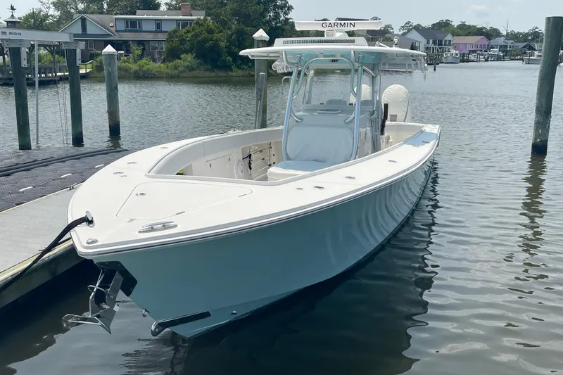 Slide: The Image of 2020 Jupiter 38 boat docked in a serene marina setting. - 2