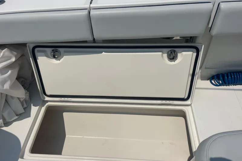 Slide: The Image of Open storage compartment on a 2020 Jupiter 38 boat, featuring a clean interior. - 23