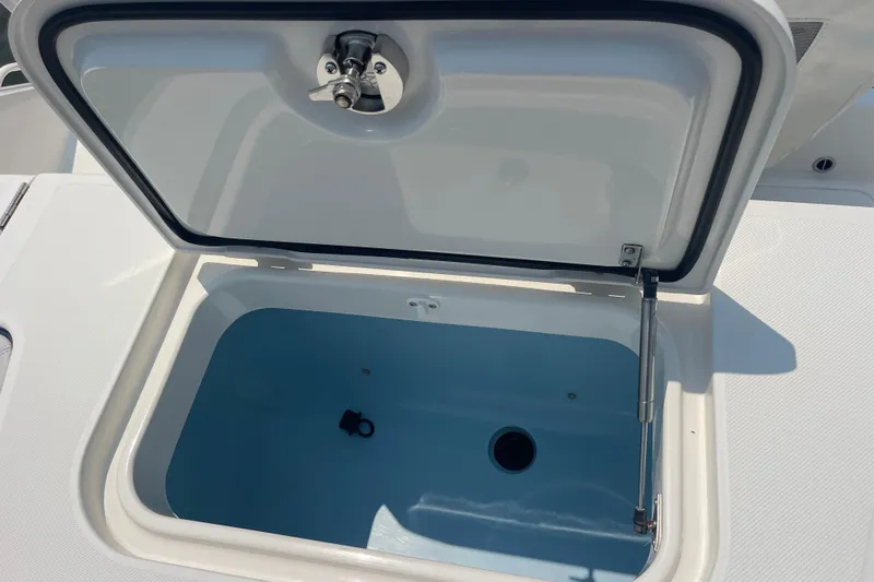Slide: The Image of Live Bait well on a 2020 Jupiter 38 boat, featuring a secure latch. - 26
