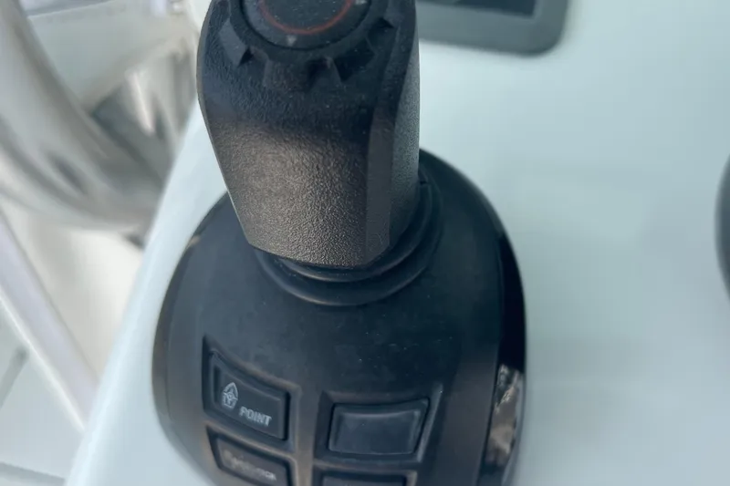 Slide: The Image of Close-up of a 2020 Jupiter 38 boat joystick control system. - 33
