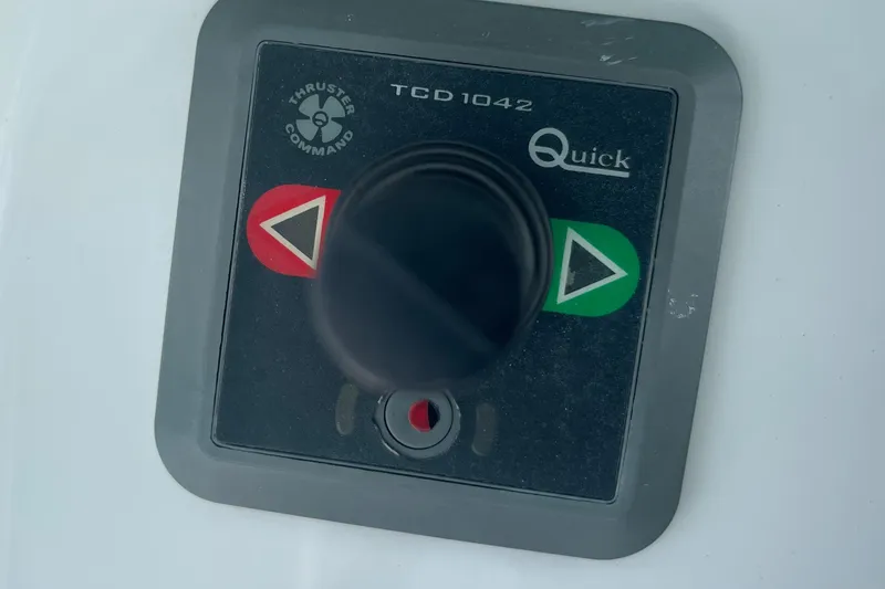 Slide: The Image of Control panel of a 2020 Jupiter 38 boat with thruster command joystick. - 34