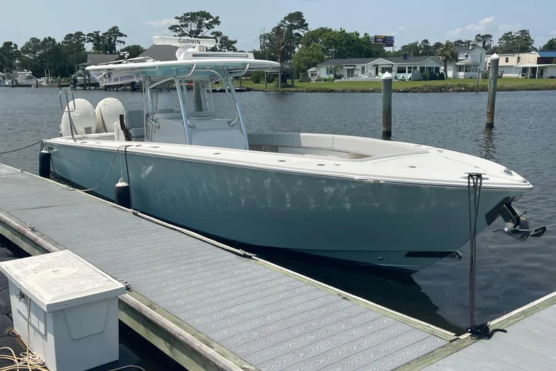 Slide: The Image of 2020 Jupiter 38 boat docked on a sunny day, featuring sleek design and modern equipment. - 4