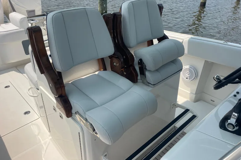 Slide: The Image of Luxury seating on a 2020 Jupiter 38 boat, featuring plush, light gray upholstery. - 42