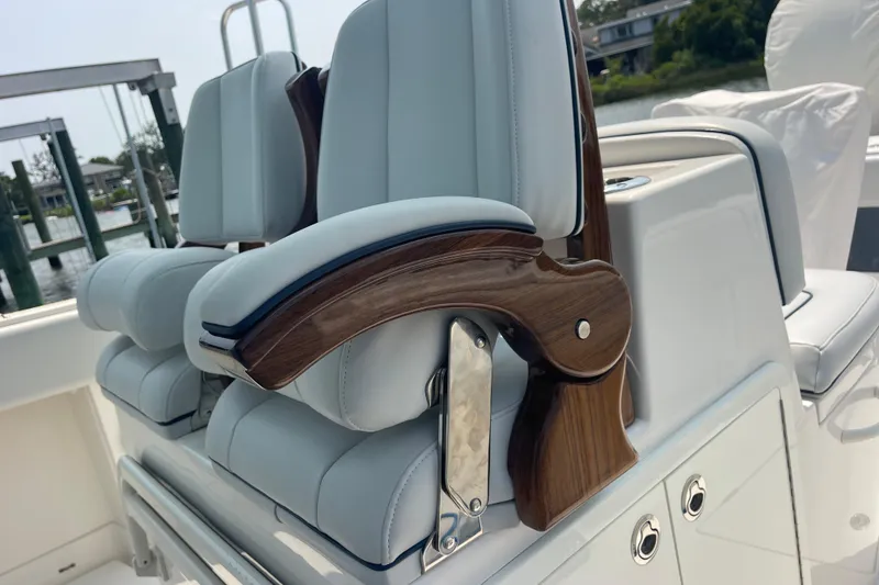 Slide: The Image of Luxury seating on a 2020 Jupiter 38 boat with elegant wood accents. - 43