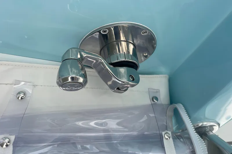 Slide: The Image of Chrome fitting on 2020 Jupiter 38 boat, mounted on light blue surface. - 46