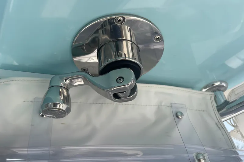 Slide: The Image of Chrome handle on a 2020 Jupiter 38 boat against a light blue background. - 47