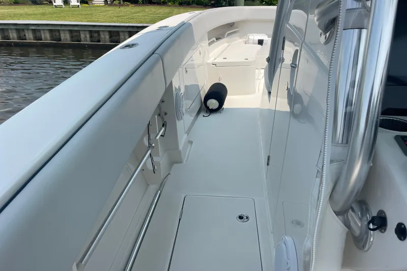 Slide: The Image of 2020 Jupiter 38 boat deck, sleek design, docked by calm waters. - 51