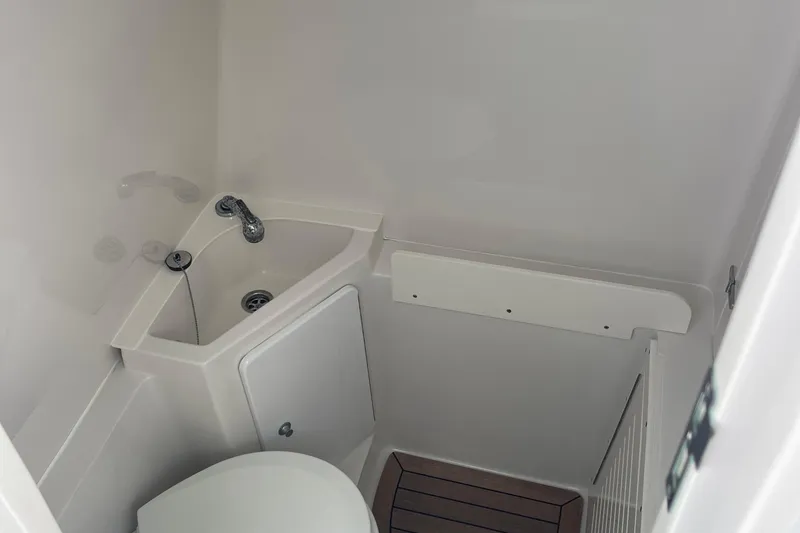 Slide: The Image of Compact bathroom in 2020 Jupiter 38 boat with sink and toilet. - 57