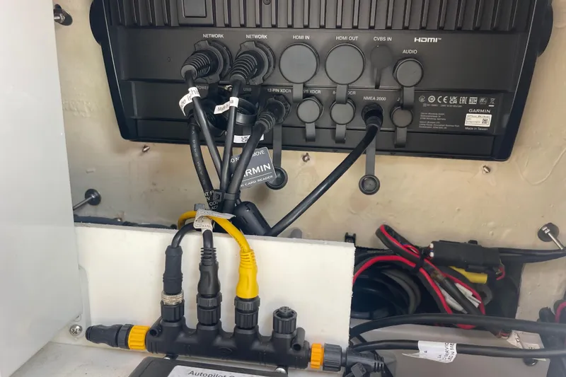 Slide: The Image of Garmin marine electronics setup on a 2020 Jupiter 38 boat, featuring network and HDMI connections. - 59