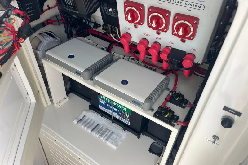 Slide: The Image of Electrical system of a 2020 Jupiter 38 boat, featuring battery switches and wiring. - 62