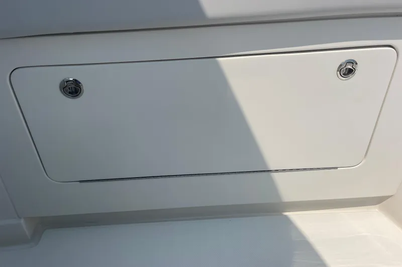 Slide: The Image of Compartment door on a 2020 Jupiter 38 boat, featuring dual locks. - 68