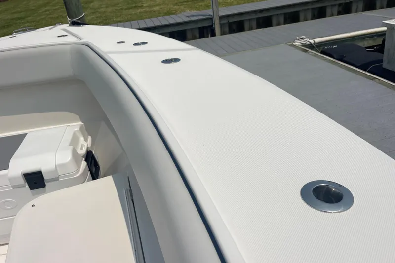 Slide: The Image of 2020 Jupiter 38 boat deck with rod holders and storage compartment. - 78