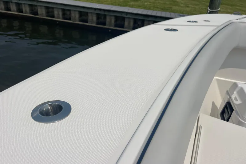 Slide: The Image of 2020 Jupiter 38 boat deck with stainless steel fittings by the water. - 79
