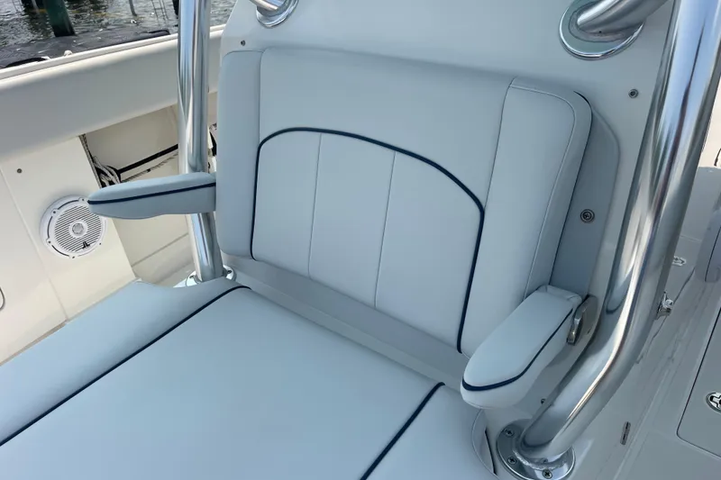 Slide: The Image of Luxury seating on a 2020 Jupiter 38 boat with sleek design and armrests. - 82